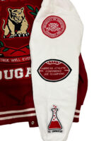 Houston Cougars varsity jacket right sleeve in white leather with rib-knit cuff and red-and-white design with chenille logos.