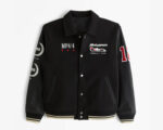 McLaren Formula 1 Team Black Varsity Jacket front view with leather sleeves, team logo on chest, MP4/4 patch, and rib-knitted collar, cuffs, and waistband.