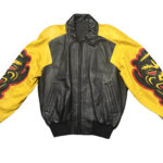 Vintage Michael Hoban North Beach black and yellow leather jacket with tribal mask design, front view with shirt collar, YKK zipper, and rib-knit cuffs.