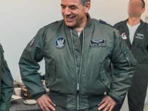 Man wearing a green M1-A flight bomber jacket with patches