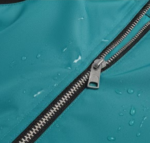 Water resistant zipper on teal windbreaker close-up