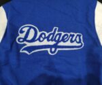 MLB LA Dodgers women varsity jacket Back view of Dodgers Spell logo.