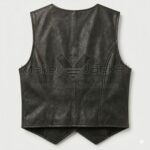 Back view of Black Leather Vest featuring a center seam, two curved princess seams for tailoring, and a pointed, waistcoat-style hem.