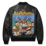 Back view of Fred Flintstones Bedrock Birthday Party Black Leather Jacket features a large patch showing Fred Flintstone's birthday party under "The Flintstones" logo text.