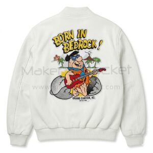 Back view of Fred Flintstones Born In Bedrock White Leather Jacket features a large cartoon artwork of Fred Flintstone playing a guitar under text reading "BORN IN BEDROCK!".