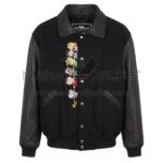 Front view of Snoopy Peanuts Tug of War Black Varsity Jacket featuring a snap-button front closure, and a vertical embroidery of stacked Peanuts characters next to the buttons with Maker Of Jacket brand label