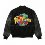 Back view of The Flintstones Bedrock 1994 Black Varsity Jacket featuring a colorful, globe-shaped graphic patch with a yellow "The Flintstones" logo across the center.