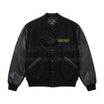 Front view of The Flintstones Bedrock 1994 Black Varsity Jacket featuring yellow embroidered text "FILMED ON LOCATION BEDROCK '94 A.D." on the left chest.