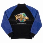 Back view of The Flintstones World Premiere Suede Leather Jacket featuring large globe graphic patch, "The Flintstones" logo, and "WORLD PREMIERE" text.