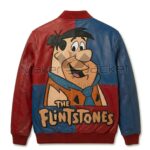 Back view of The Fred Flintstones Color Block Leather Jacket featuring a large patch of Fred Flintstone above "The Flintstones" logo text.