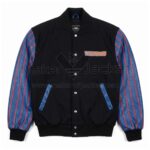 Front view of Vintage The Flintstones Jeff Hamilton Varsity Jacket featuring blue and red striped leather sleeves, blue pocket trim, and "The Flintstones" logo on the left chest.