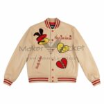 Front View Of Strictly Stacked Beige varsity jacket Featuring Flirt at Your Own Risk Embroidery and Broken Heart S Patch.