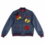 Front View Of Strictly Stacked Blue varsity jacket Featuring Flirt at Your Own Risk Embroidery and Broken Heart S Patch.