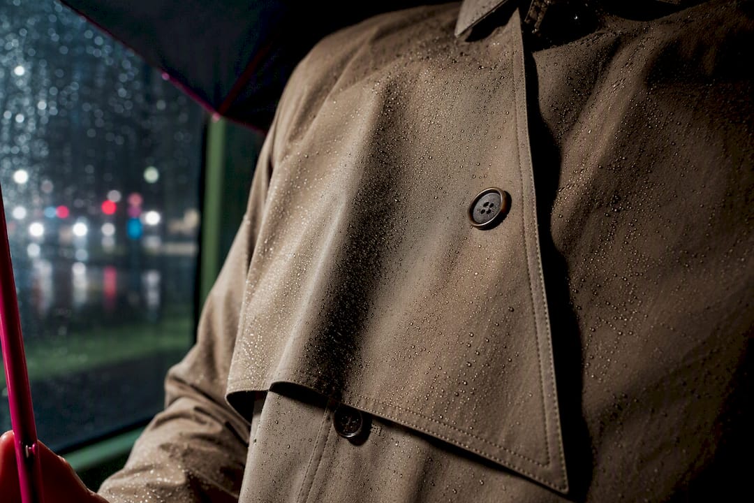 Trench coat storm flap shedding rain