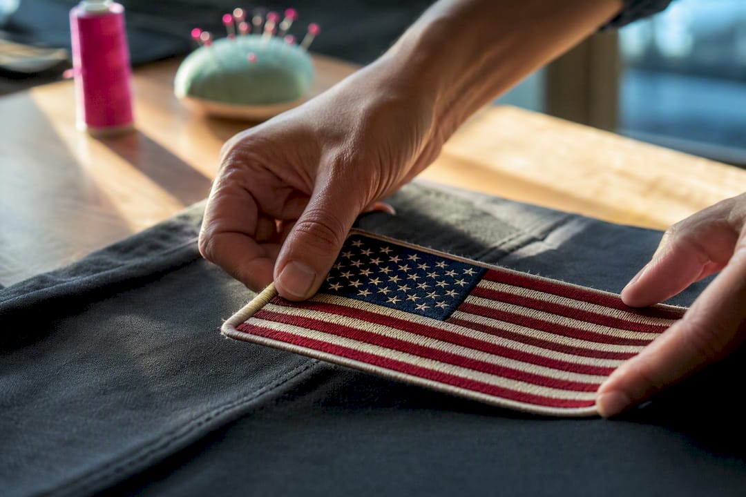 Embroidered flag patch on garment fabric