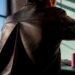 Leather back pleat expanding during reach