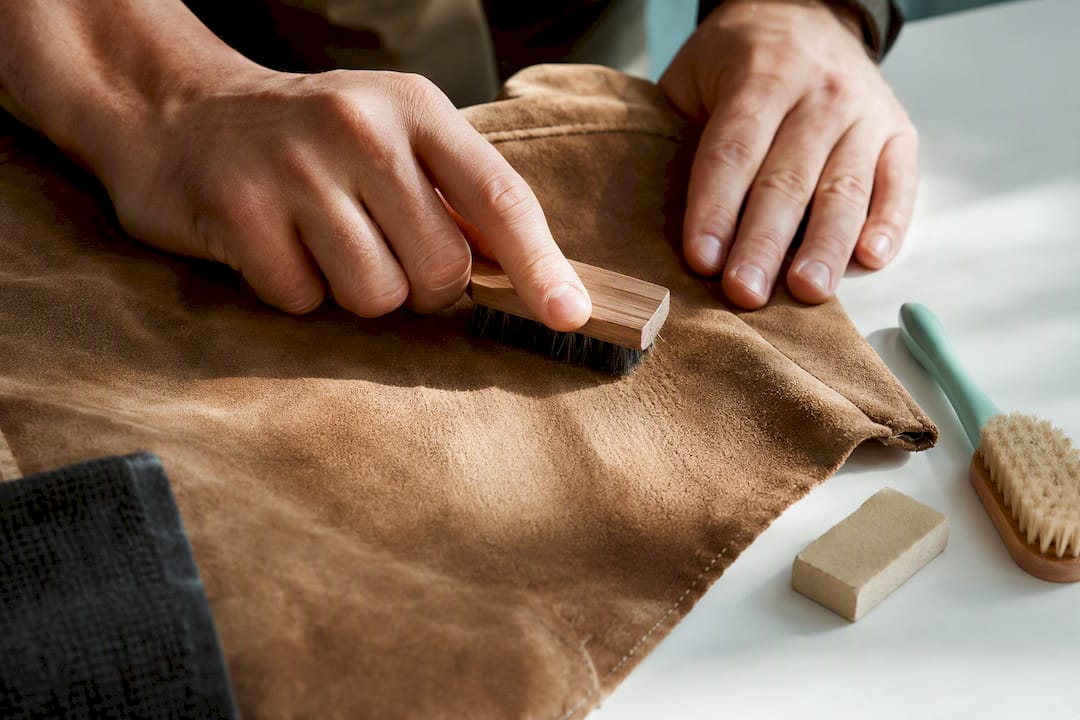 Brushing mold from a suede leather panel